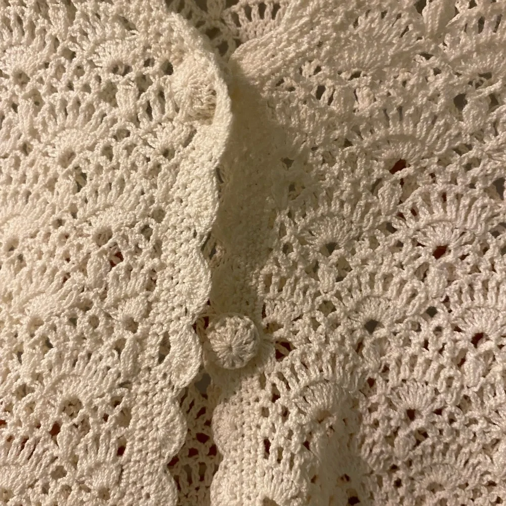 Cornelloki Crocheted Cream Sweater